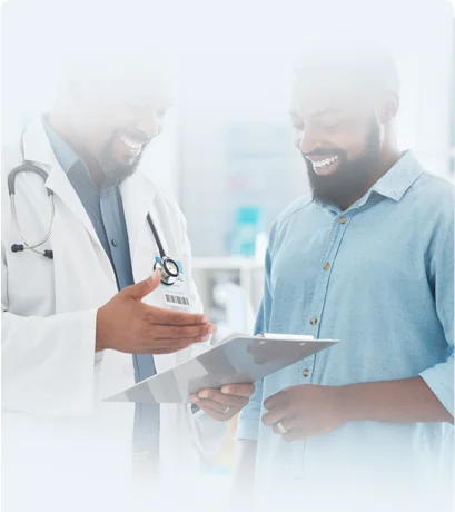 Doctor speaking with male patient about testerone replacement therapy at Doctors Plus Urgent Care in Concord, NC.