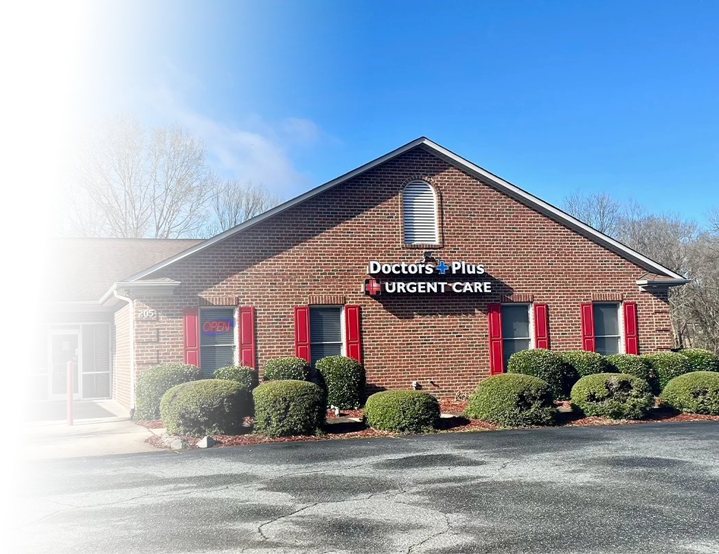 Brick building with Doctors Plus Urgent Care Sign in Concord, NC.