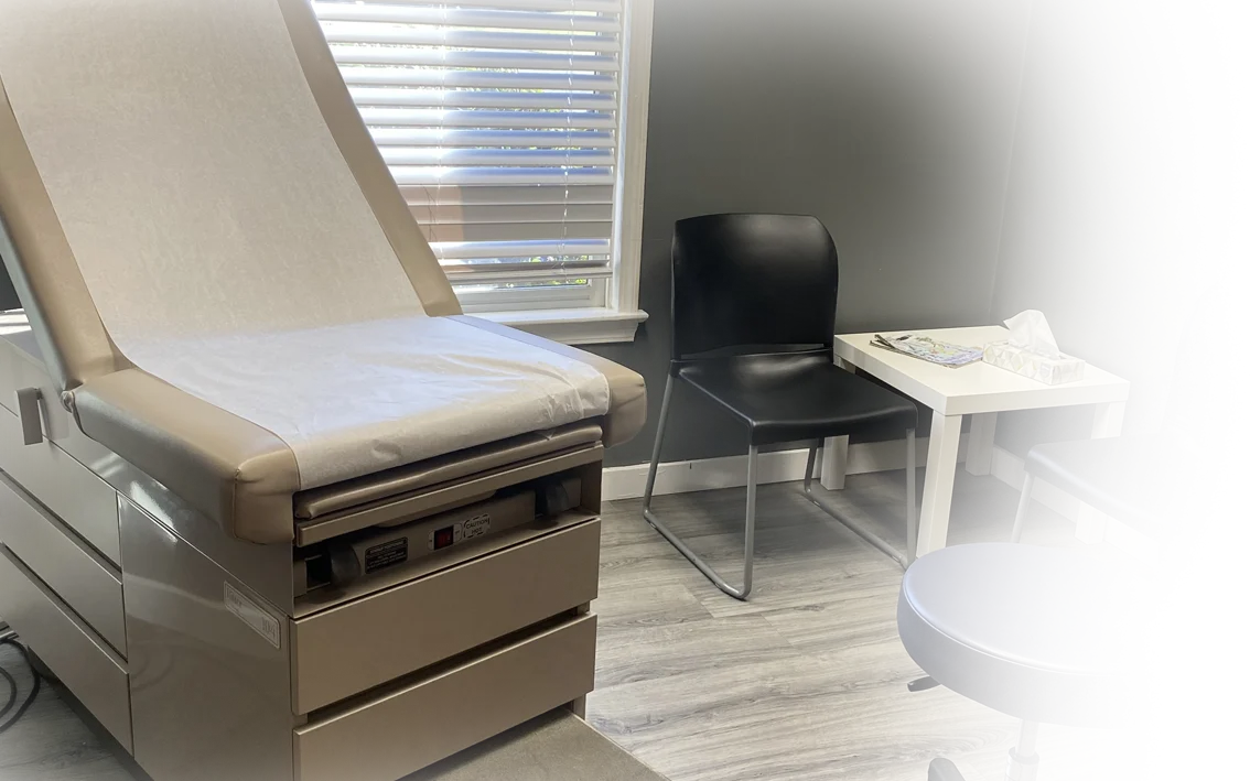 Brown patient chair at Doctors Plus Urgent Care in Concord, NC.
