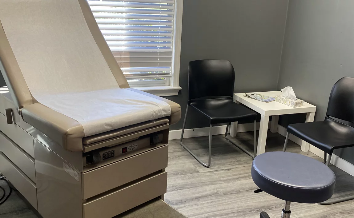 Brown patient chair at Doctors Plus Urgent Care in Concord, NC.